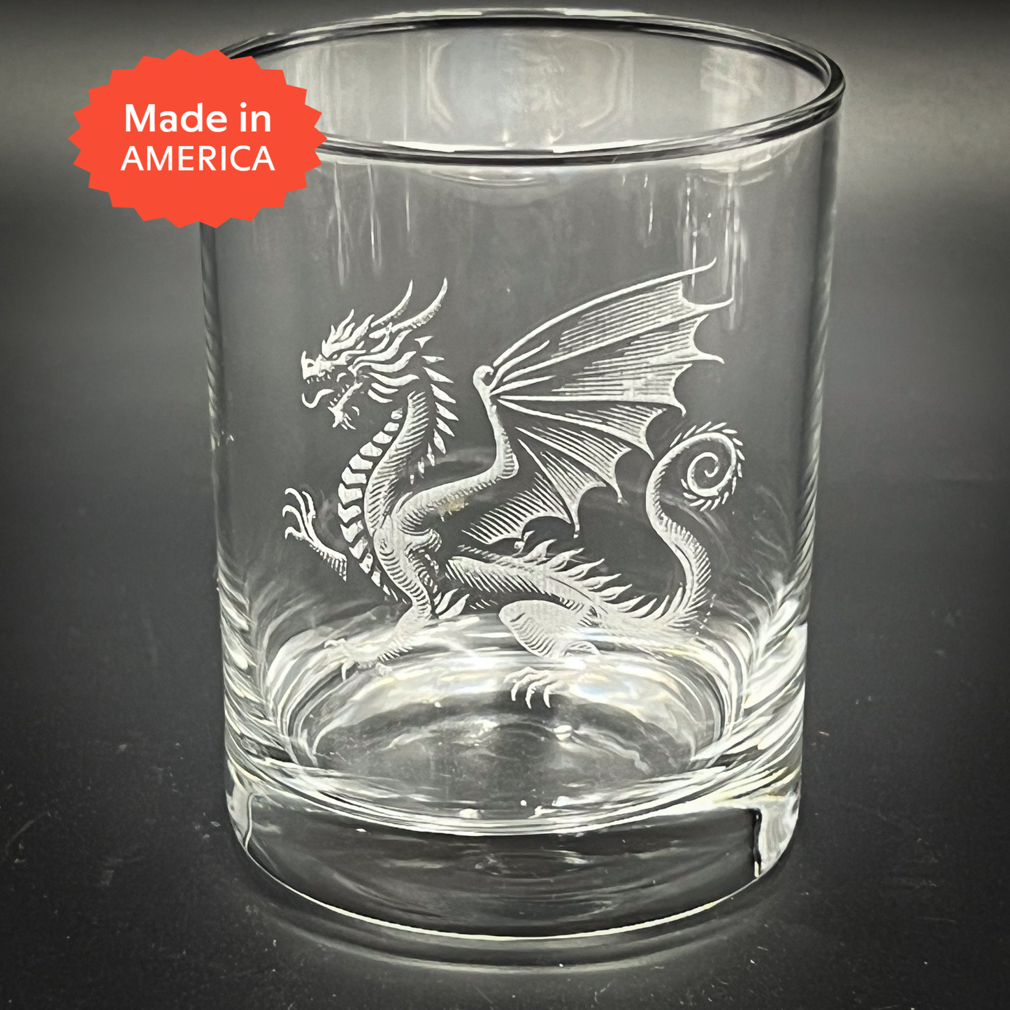 a glass with a dragon etched on it