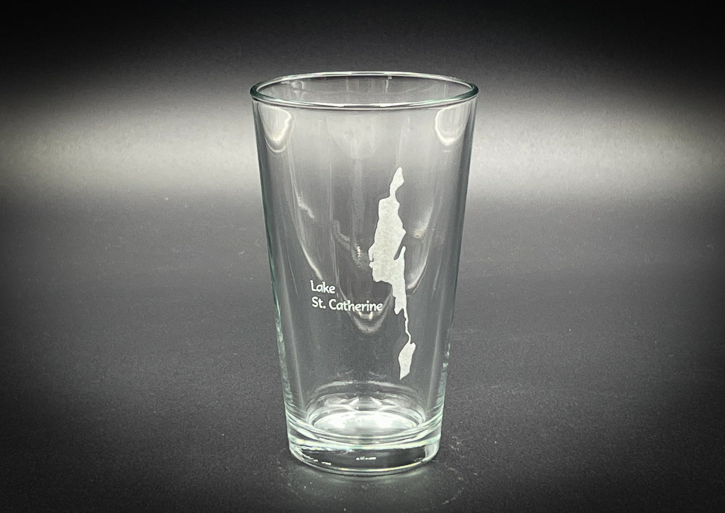 a shot glass with a map of st george on it