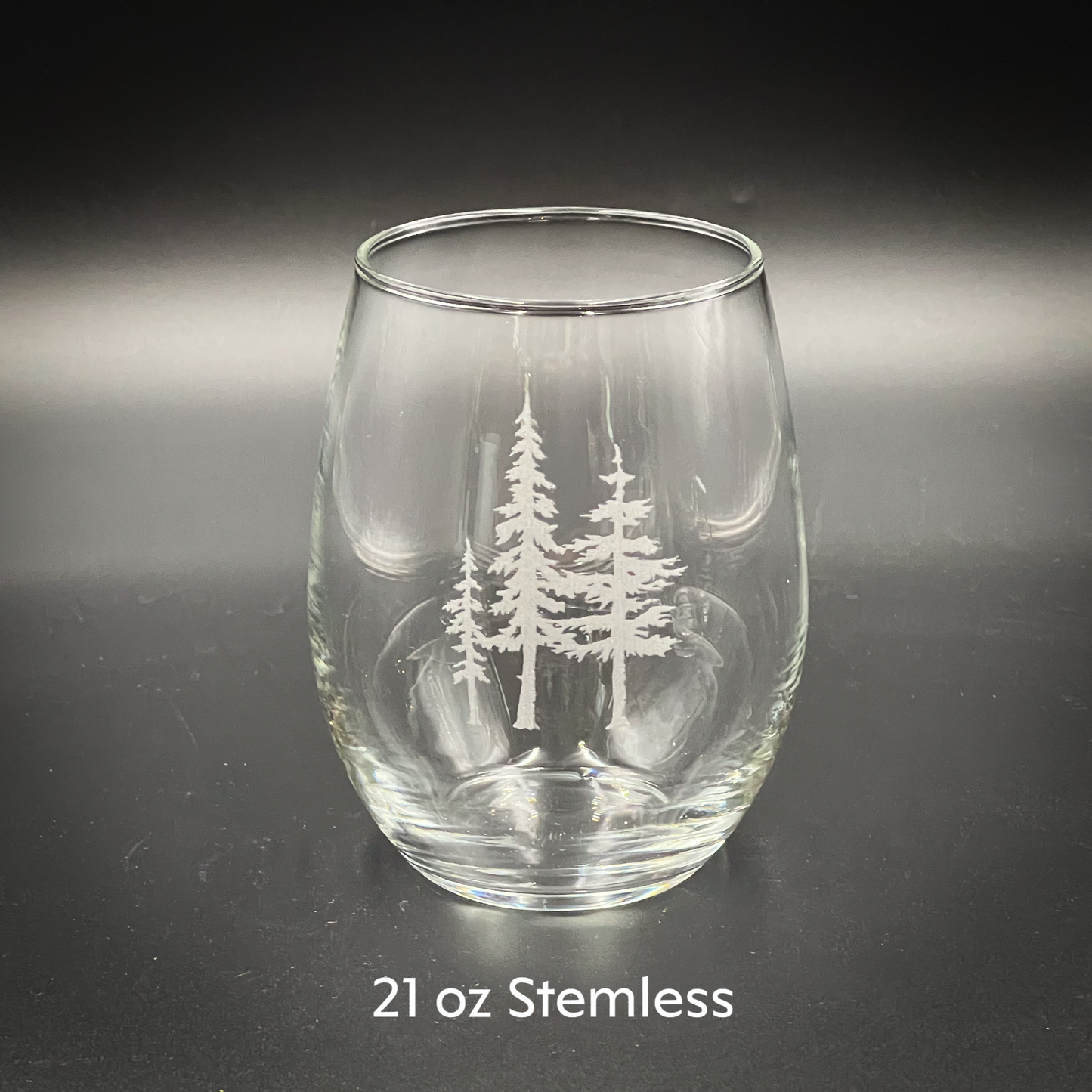 a clear glass with white trees on it