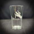 A clear glass with a white design on it, featuring a map of Lake Winnipesaukee.