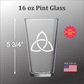 a 16 oz Pint glass with a white design on it.
