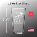 A 16 oz Pint glass with a custom text etched onto it, featuring a moose illustration.