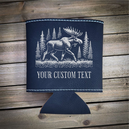 A black leather cooler with a white illustration of a moose and pine trees printed on it, along with the text "YOUR CUSTOM TEXT" printed below.