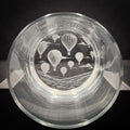 a glass with a design of hot air balloons on it.