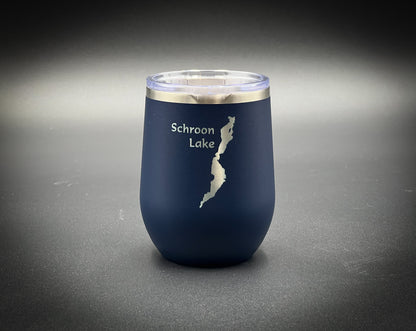 a blue wine glass with a map of the lake