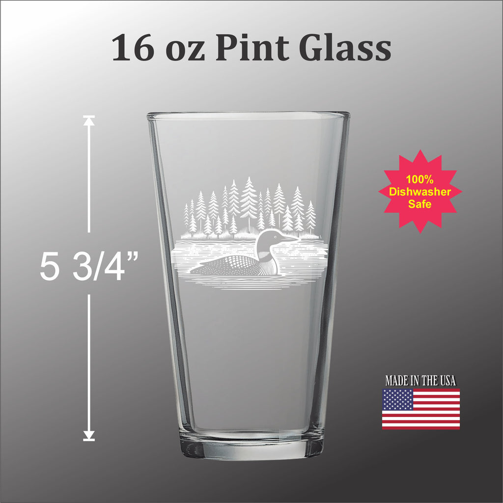 a pint glass with a clear etched design of a loon on the front.