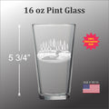a pint glass with a clear etched design of a loon on the front.
