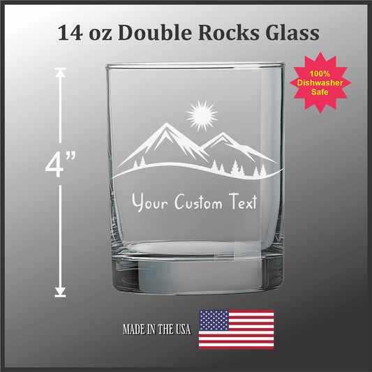 a 14 oz. Double Rocks Glass with a mountain landscape etched onto it. The glass is described as having a custom text etched into it, and it is made in the USA.