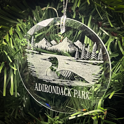 Loon on a lake - Clear Glass Ornament