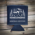 A black leather cooler with a white illustration of a moose and pine trees, along with the text "ADIRONDACK MOUNTAINS" printed on it.