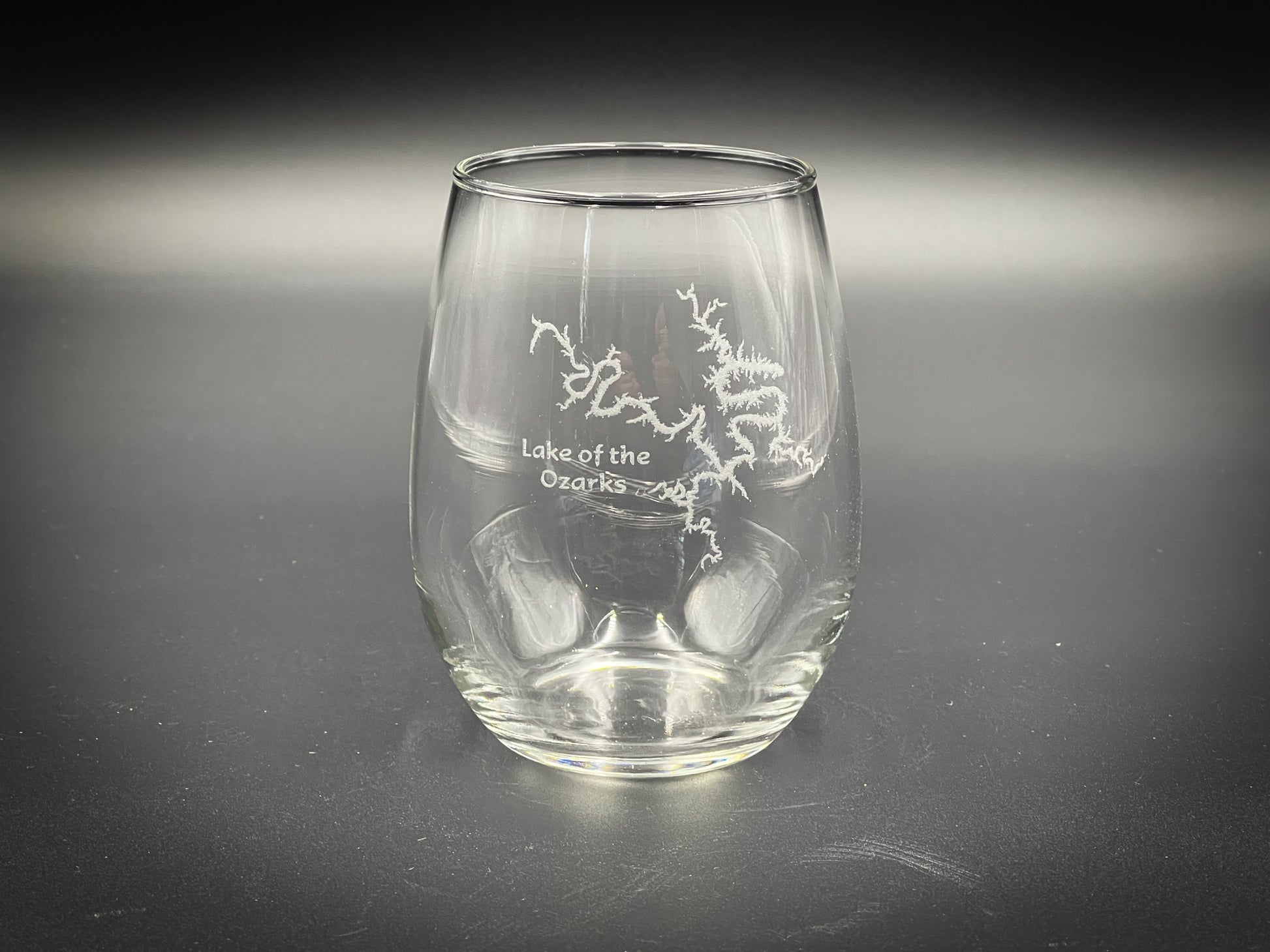 a clear glass with white writing on it