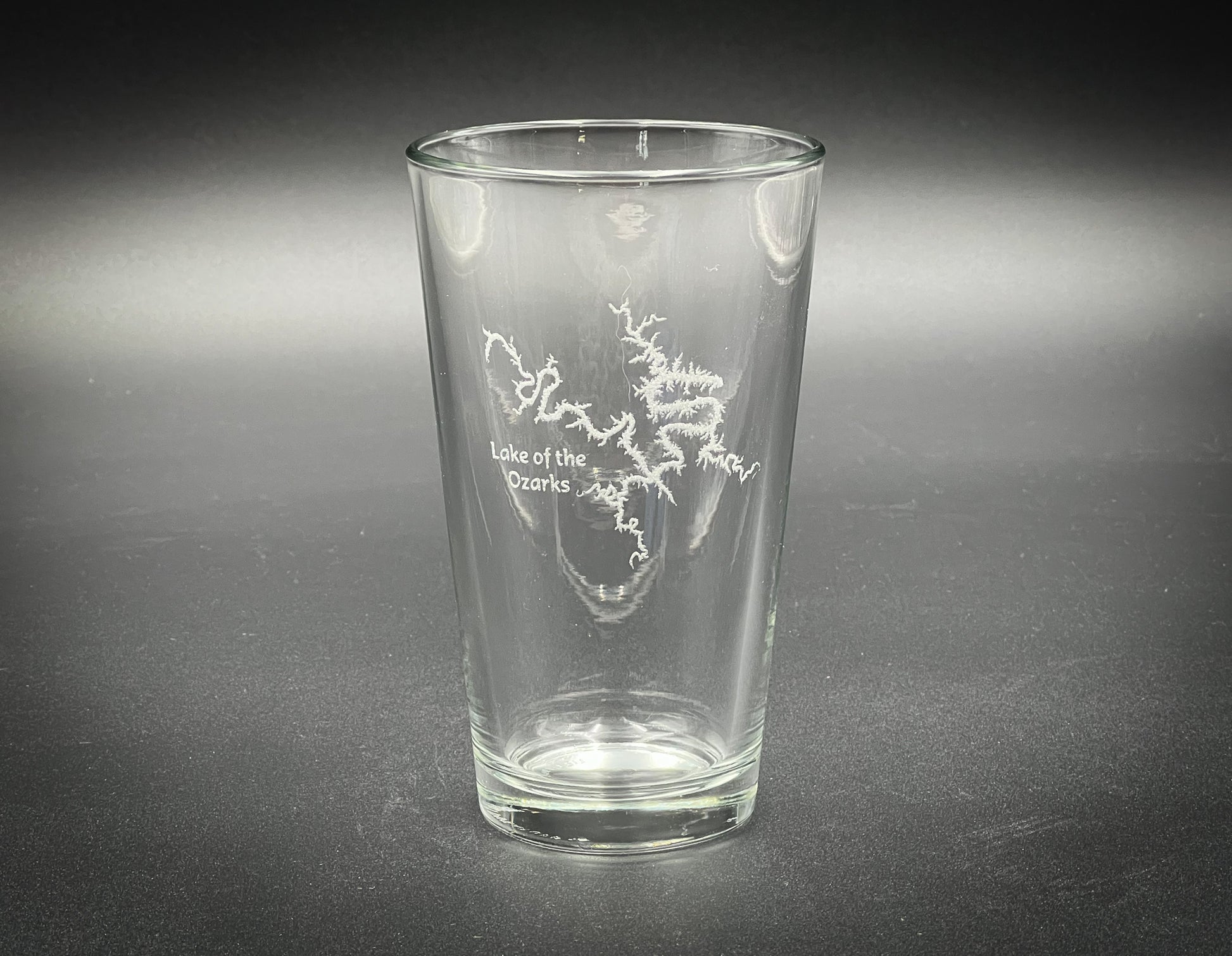 a clear glass with a map etched on it