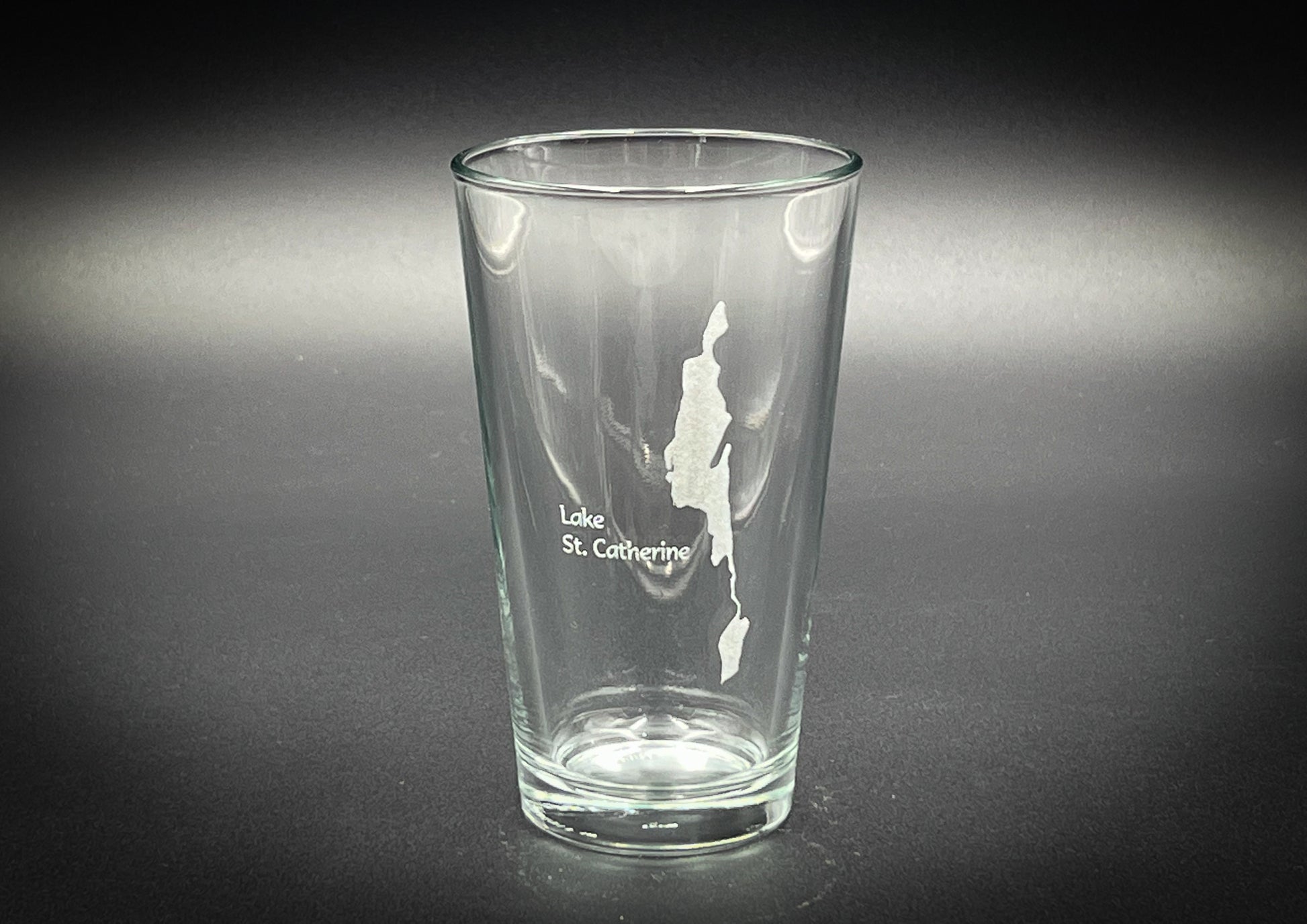 a shot glass with a map of st george on it
