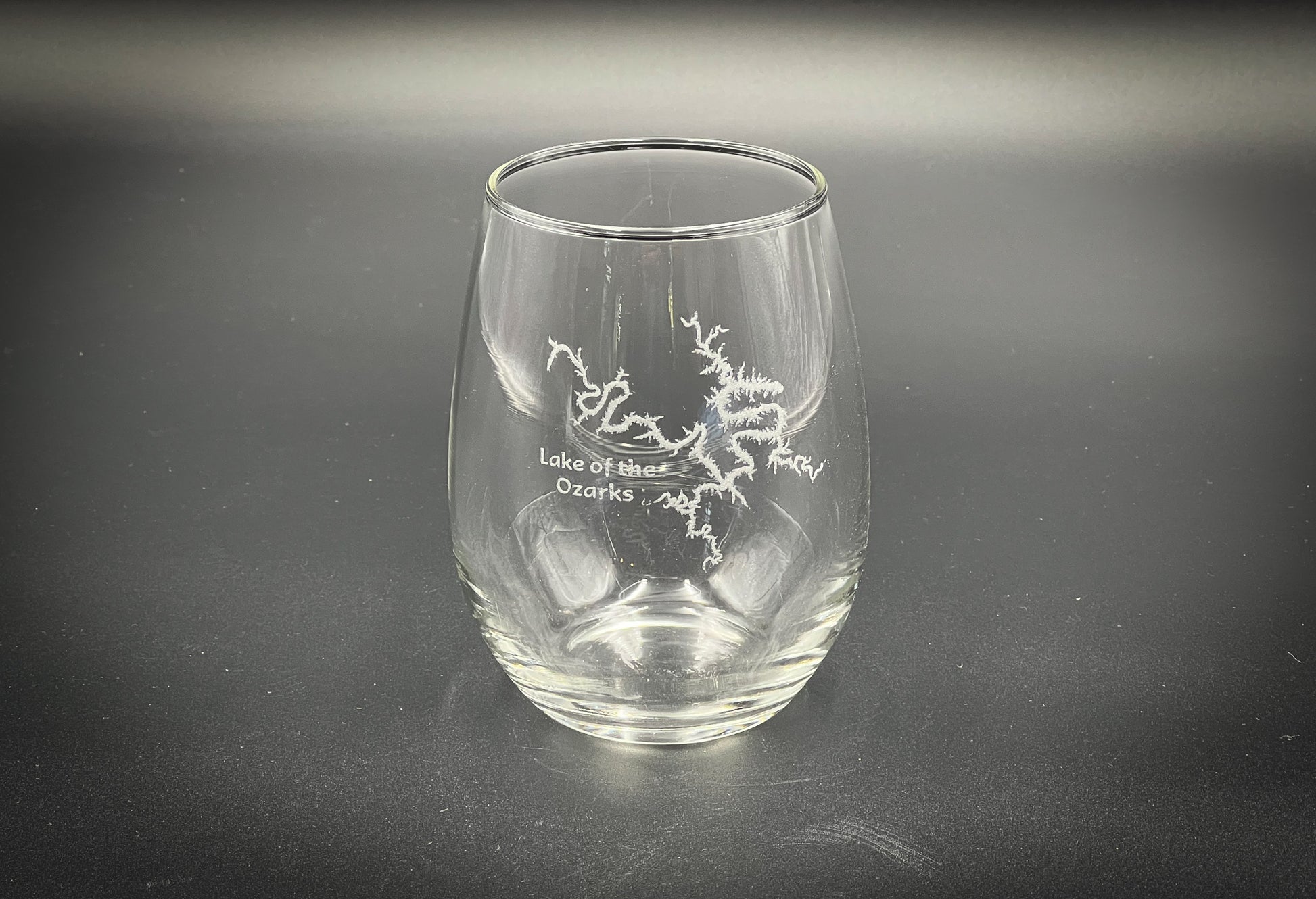 a glass with a picture of a bird on it