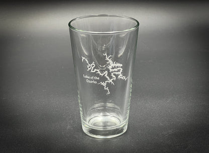 a clear glass with a white design on it