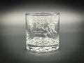 a glass with a picture of a dragon on it