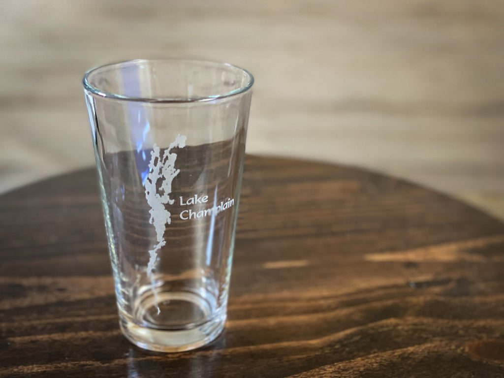 a shot glass sitting on top of a wooden table