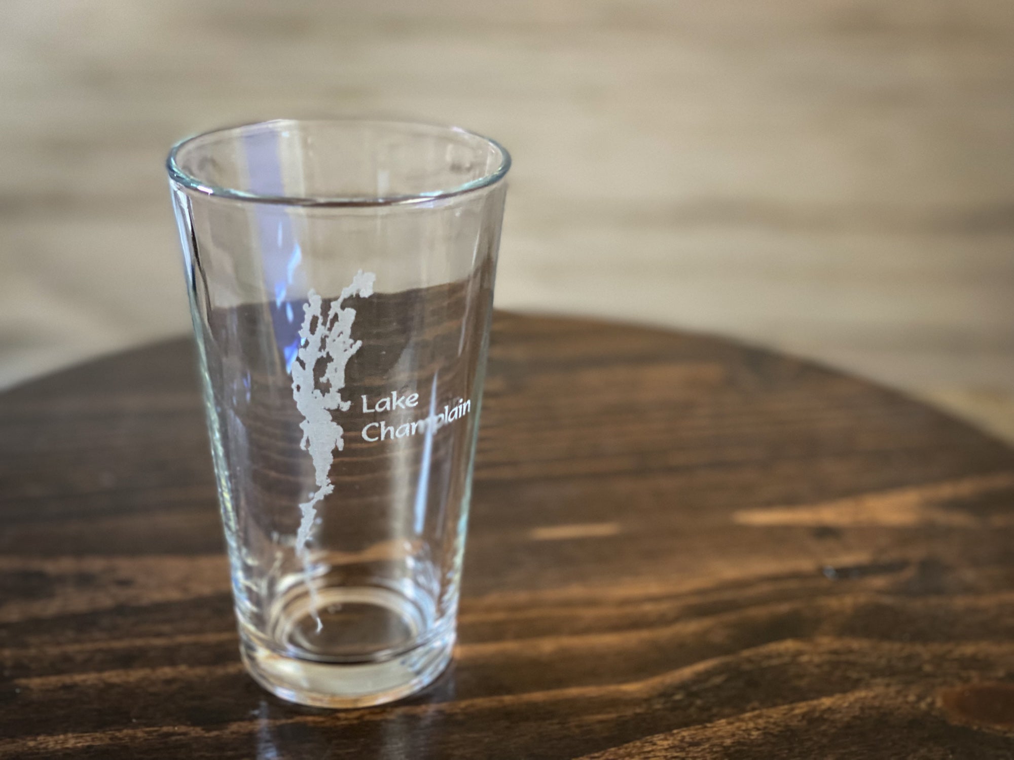 a shot glass sitting on top of a wooden table