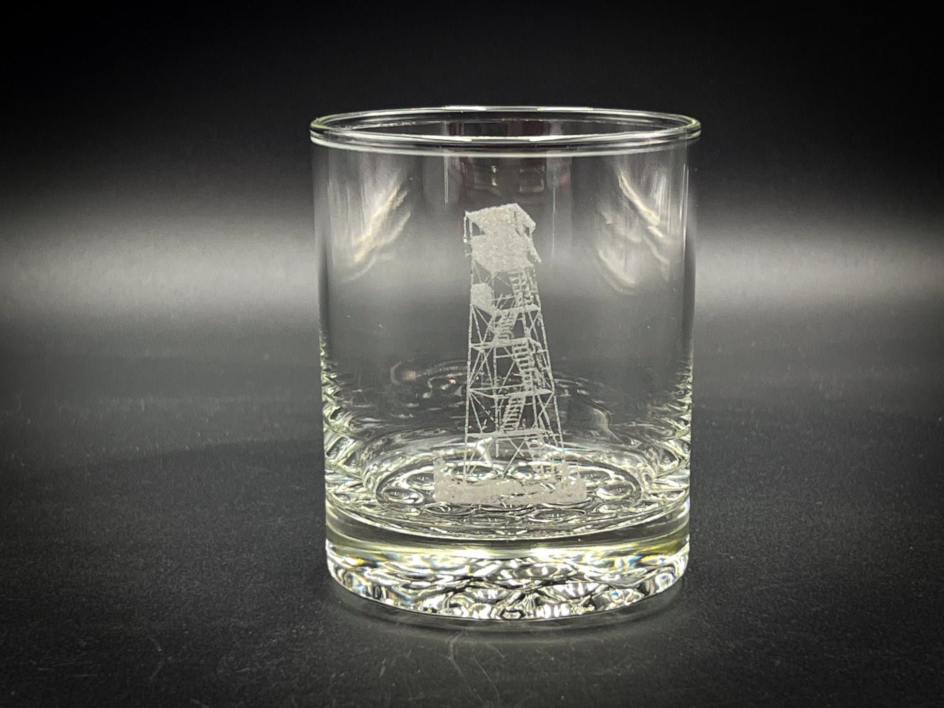 a glass with a picture of a windmill on it